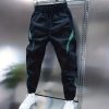 Men’s Long Pants And Casual Trousers – Feature an Elastic Waistband with a Drawstring – for Easy Adjustment. The Main Color Is Black – Complemented by Green Color-Blocking – for a Stylish And Modern Look. Suitable for Various Occasions Such As Daily Wear A